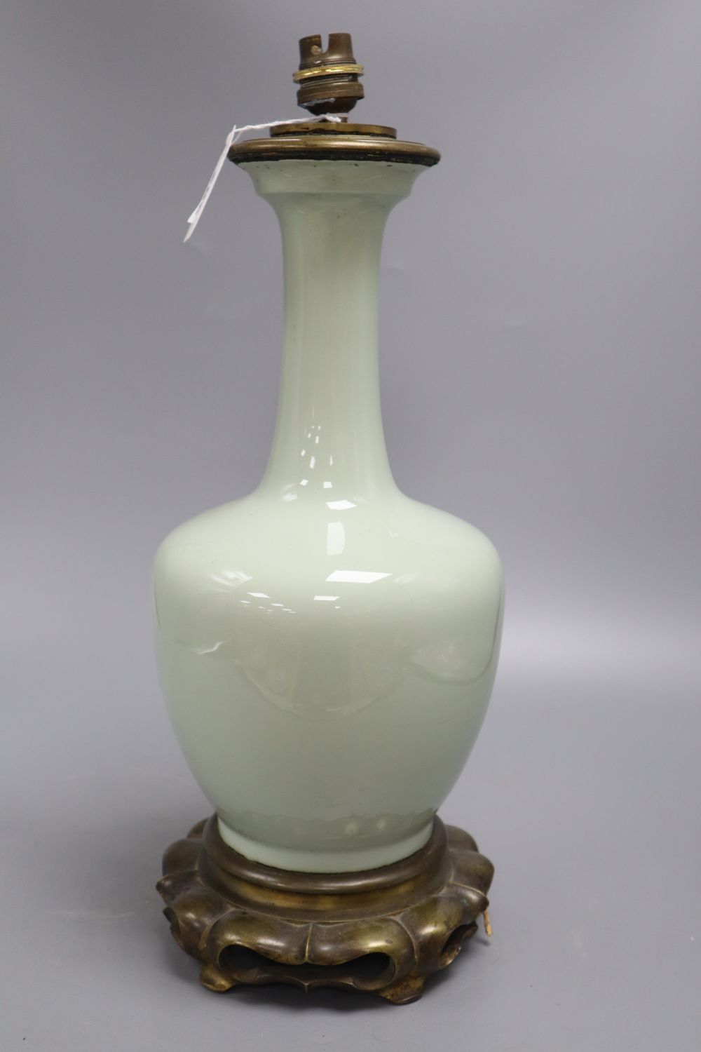 A Chinese celadon vase, mounted in bronze as a lamp, height 39cm